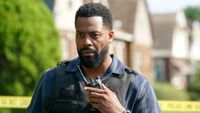 Atwater in his vest speaking into a walkie talkie on Chicago P.D.