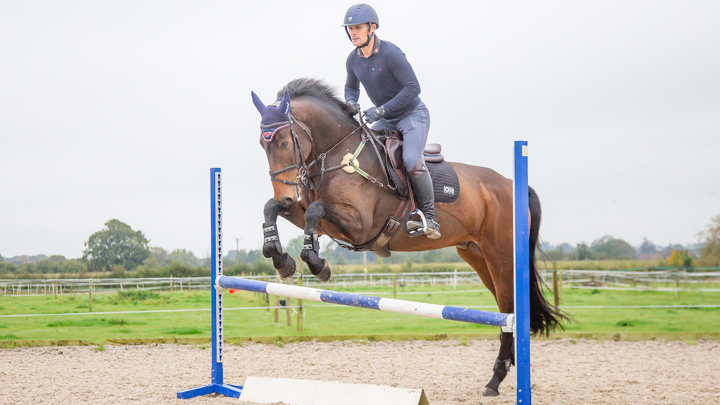Horse jumping a fence