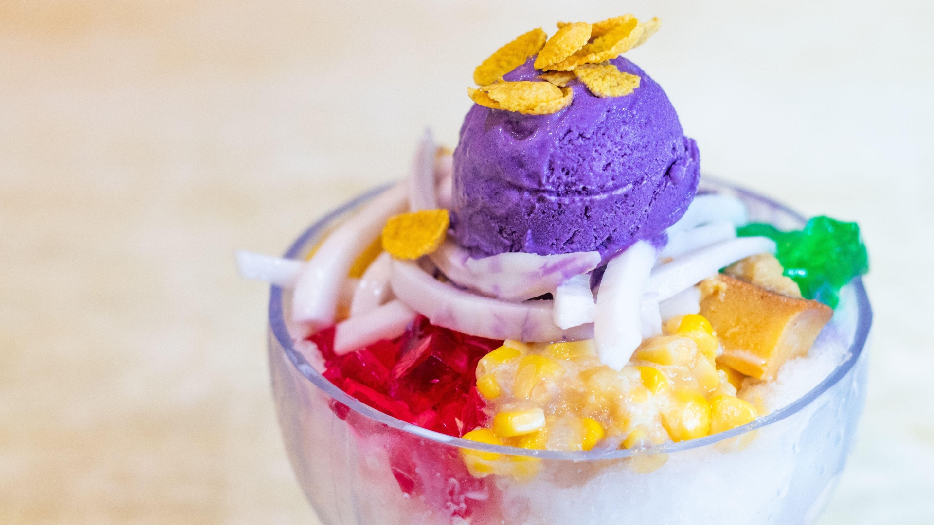 Halo-halo is a beloved Filipino dessert that features bright purple use ice cream on top