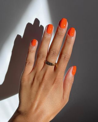 @iramshelton bright orange manicure