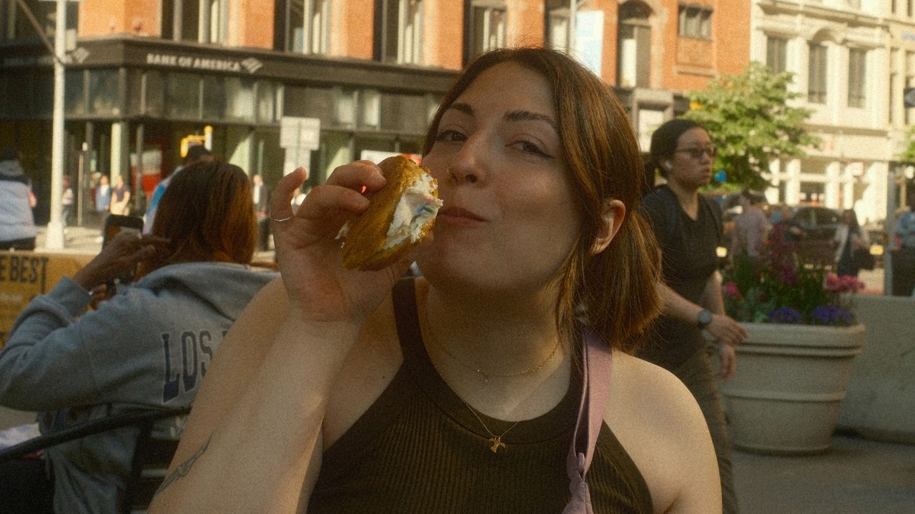 Woman holding bagel
