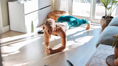 How can I make my home workouts more effective? A woman working out at home