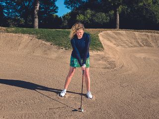 Golf Monthly Top 50 Coach Katie Dawkins demonstrating a fairway bunker shot