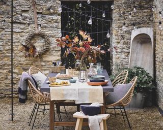 outdoor christmas dining set up with flowers