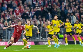Bayern Munich's Robert Lewandowski (left) in action against former club Borussia Dortmund in 2022.
