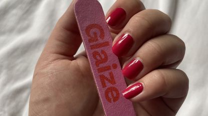 valeza&#039;s nails holding a glaize nail file after applying glaize stick-on gels 