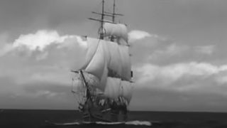 A black and white screenshot of the HMS Bounty on the high seas in Mutiny On The Bounty (1935)