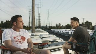 Christian Wolff looking unimpressed as his brother Braxton laughs at him in The Accountant 2