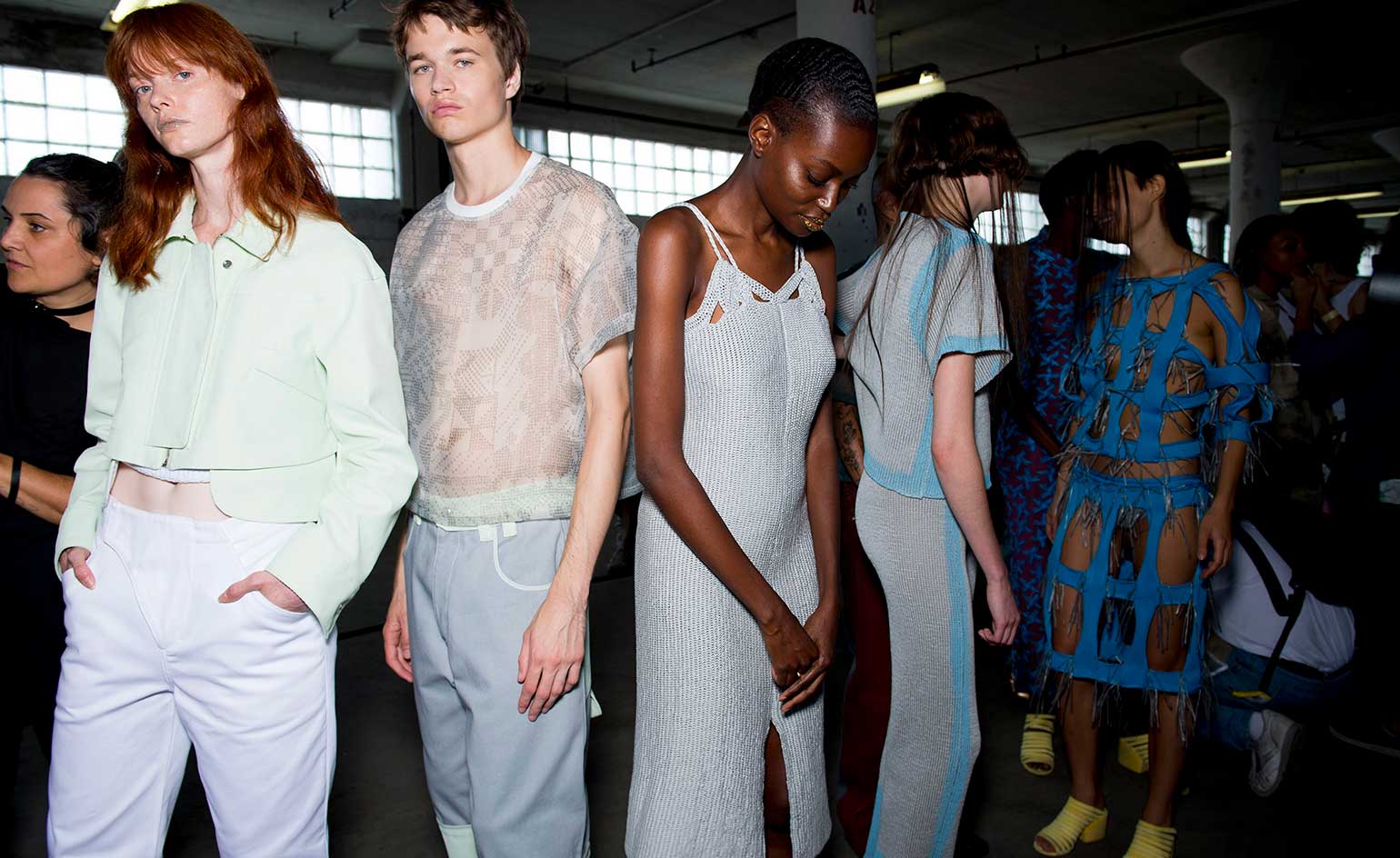 Eckhaus Latta S/S 2019 models dressed in pastel denim and translucent tops