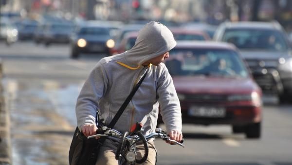 biker in traffic