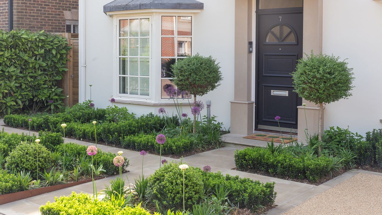 modern garden with formal paths and flower beds