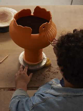 The ceramicist Alfred Lowe at work