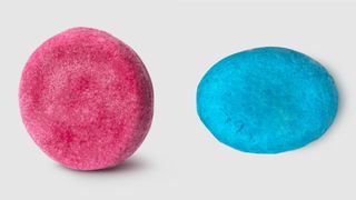 A pink shampoo bar and a blue conditioner bar from Lush.