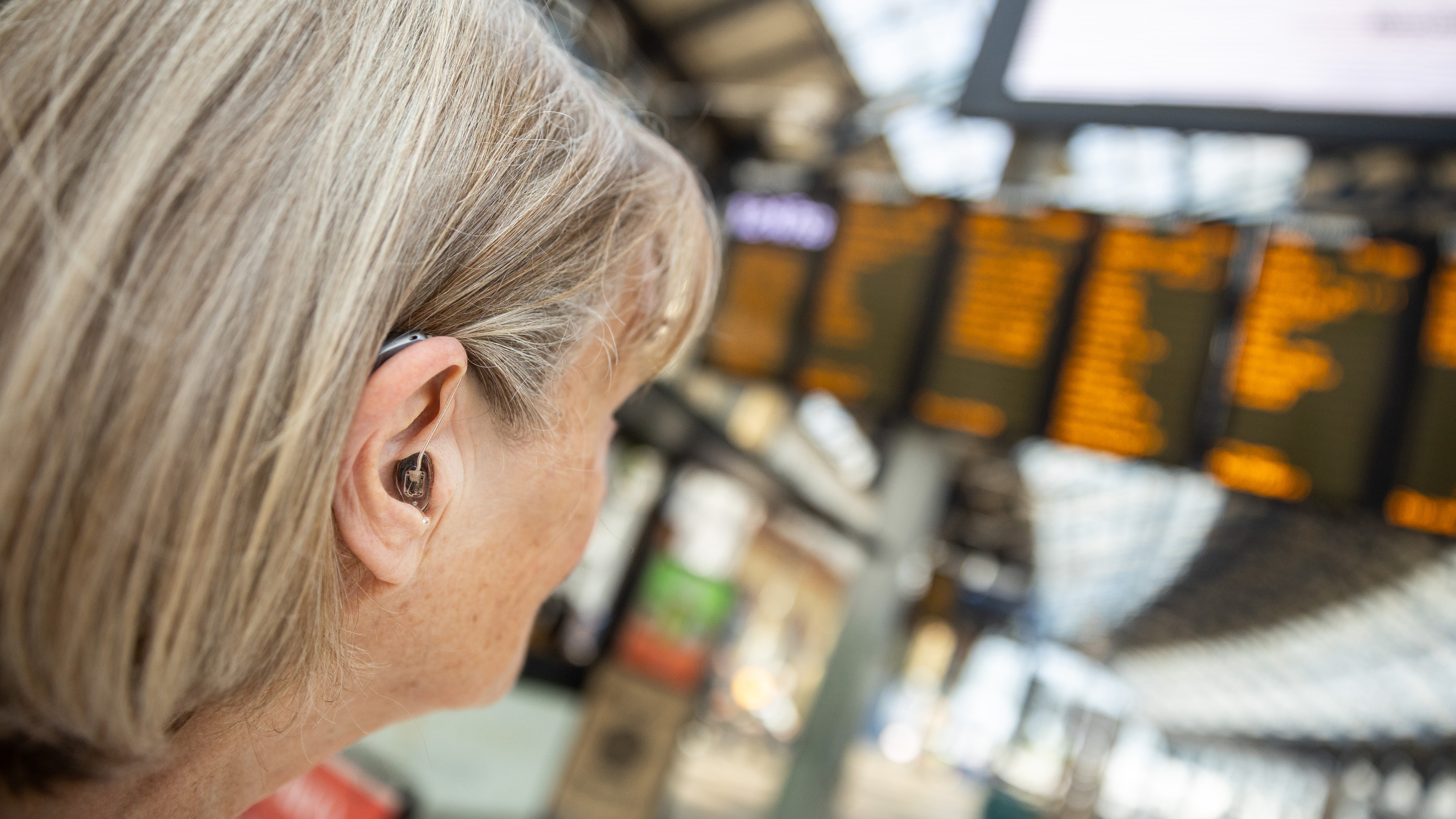Hearing disabled people using Ampetronic | Listen Technologies solutions at Brighton Station. 