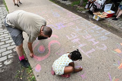 Adult and child playing.