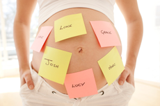 A mum-to-be with baby name post-its