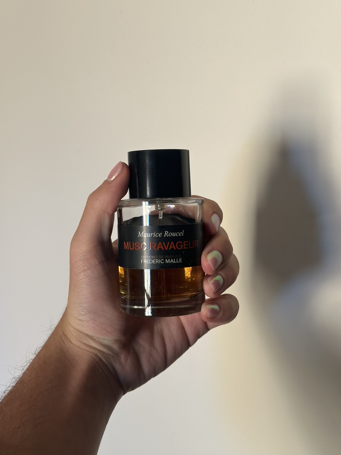 David Evan Ruff holding Frederic Malle Musc Ravageur