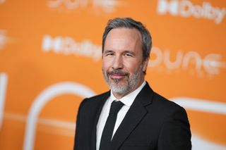 Director Denis Villeneuve wearing a jacket and tie in 2024