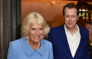 Camilla, Duchess of Cornwall, and Tom Parker Bowles attend the launch of the "Fortnum & Mason Christmas & Other Winter Feasts" cookbook at Fortnum & Mason on October 17, 2018 in London, England