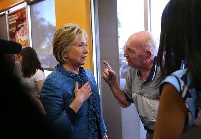 Hillary Clinton talks with a supporter in North Carolina