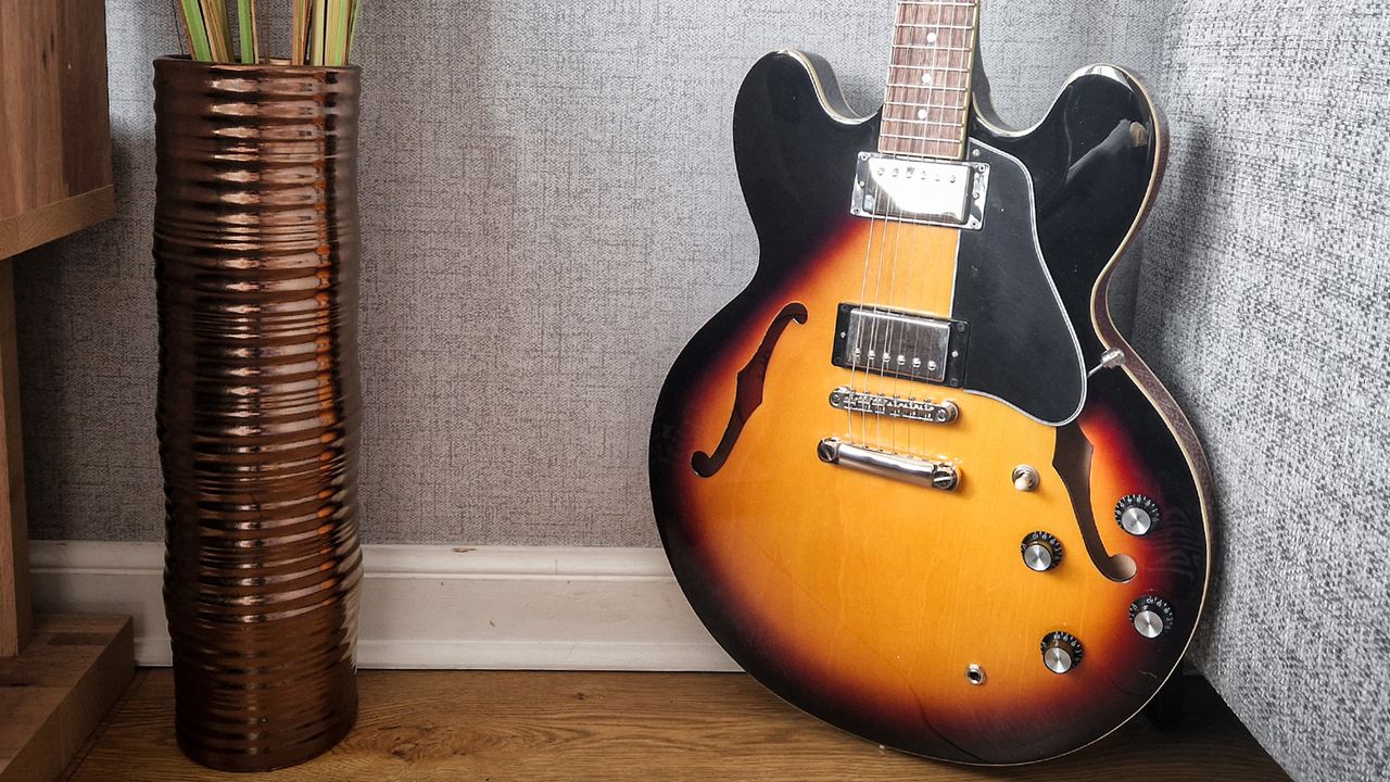 Epiphone ES-335 next to a plant pot