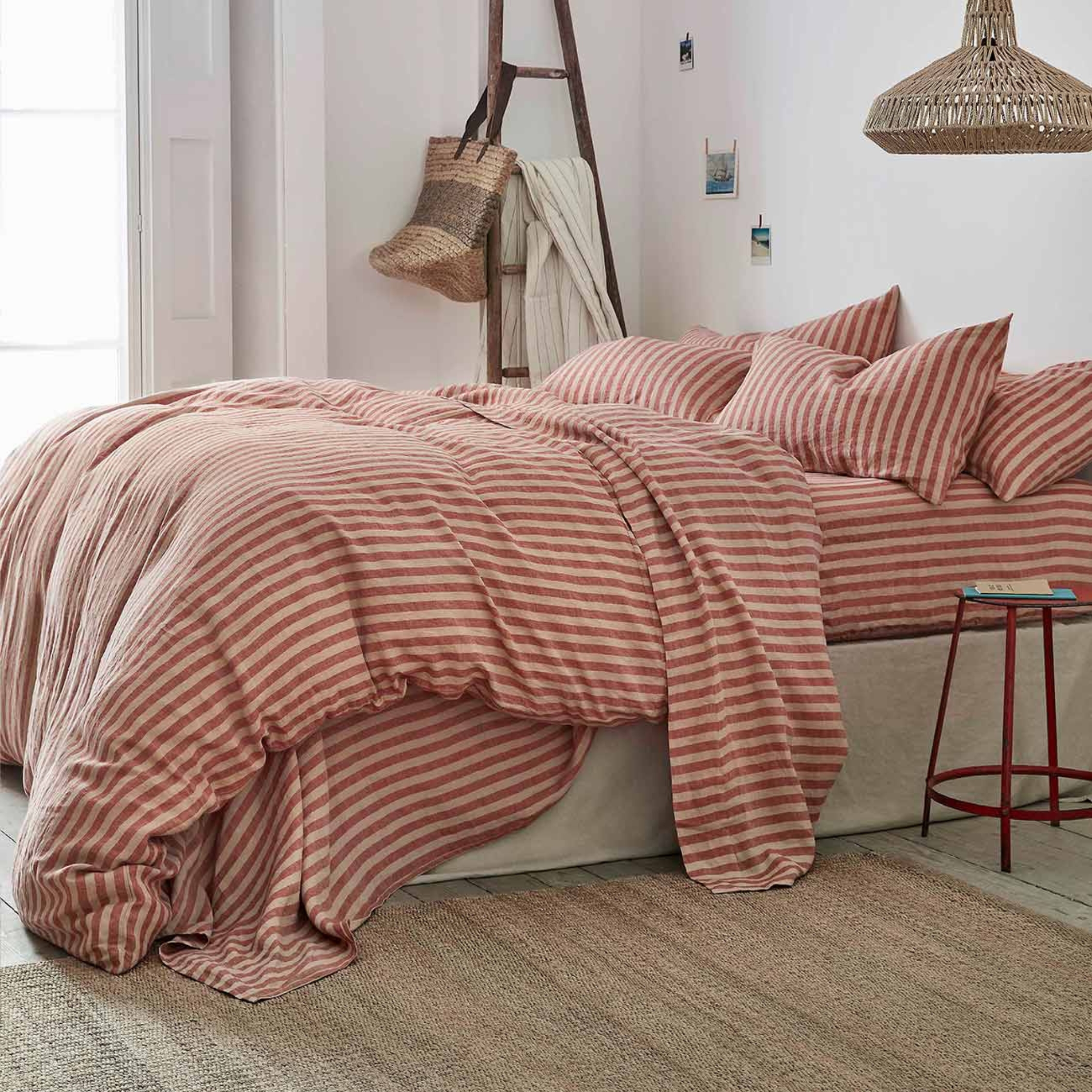 red striped bedding in a rustic bedroom