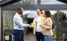 RentGuarantor article: Estate agent shaking hands with buyers 