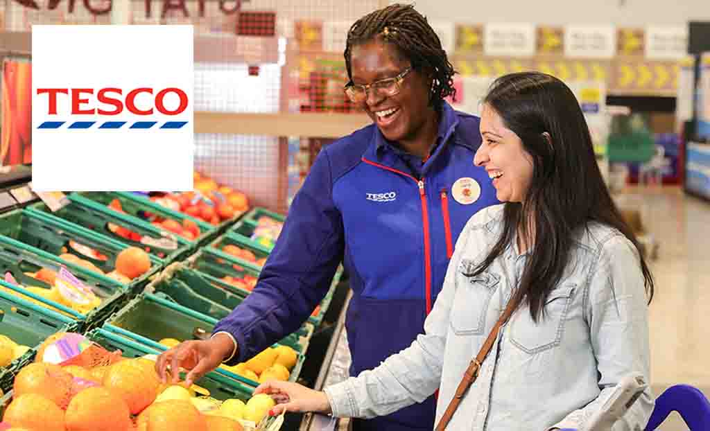 tesco logo placed top left with a tesco helper and customer looking happily at veg
