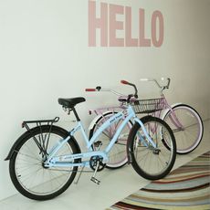bicycles on white walls and white flooring