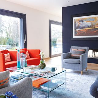 living room with grey and orange armchairs