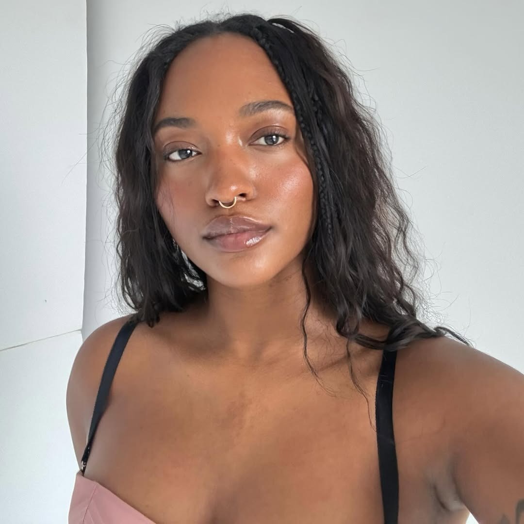 A woman with glowing skin.