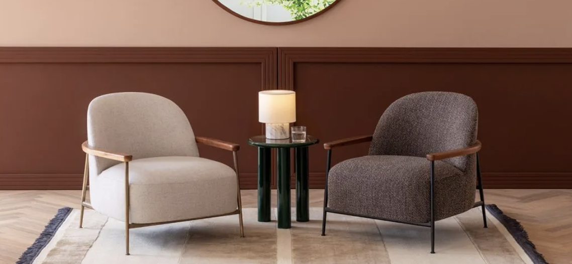 lamp on side table between two modern design chairs