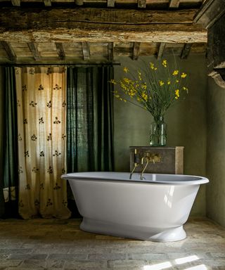 Rustic bathroom with freestanding bathtub