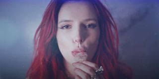 Bella Thorne Blowing A Dandelion