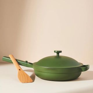 Green pan with attached green lid, black handle