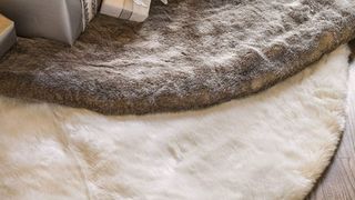 White and gray faux fur tree skirts laying on top of each other
