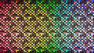 Rainbow colored iridescent semiconductor wafer extreme close-up studio shot.