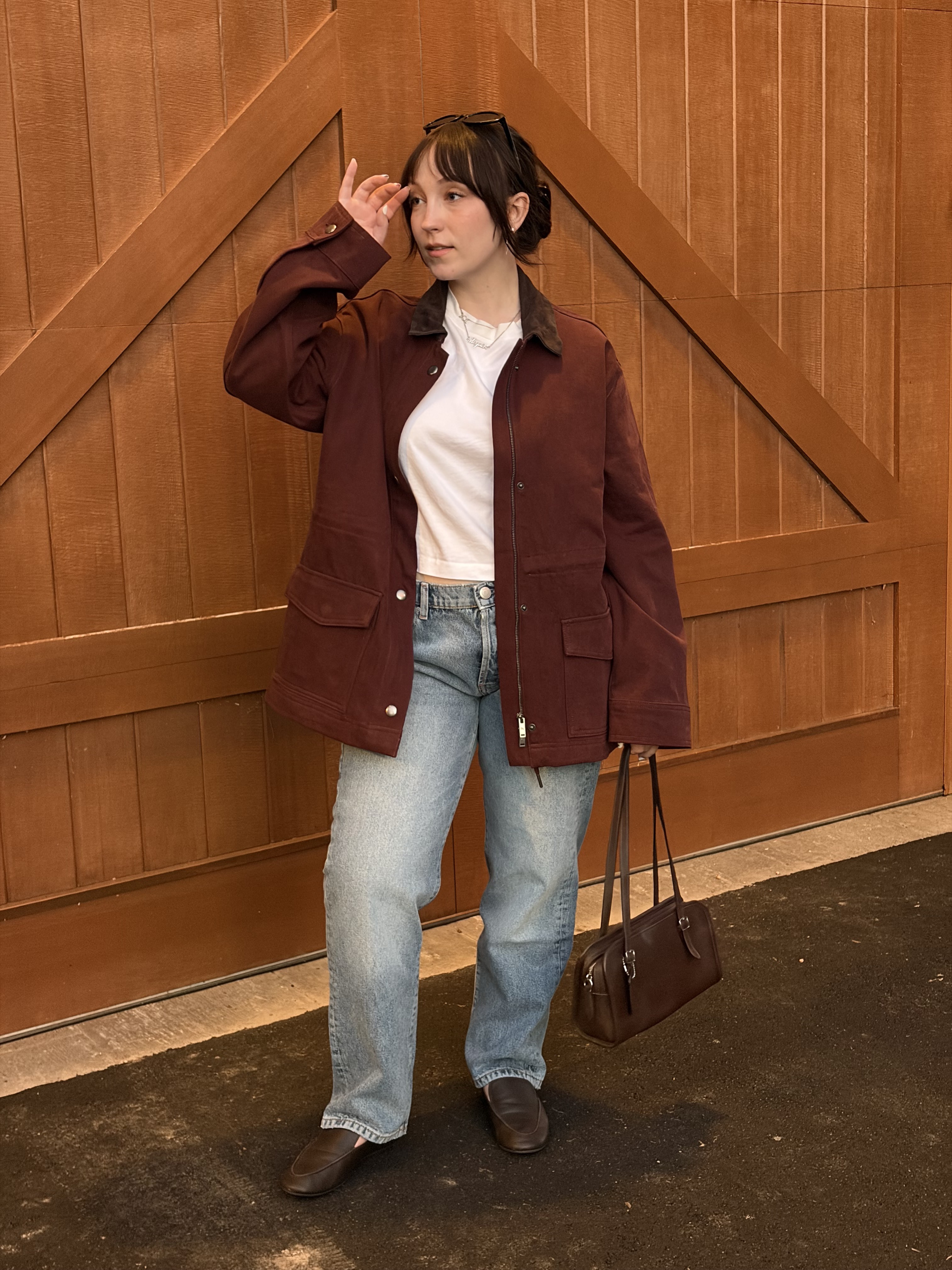 Meguire Hennes styled the burgundy barn jacket and light-wash jeans from the DL1961 and Moda Operandi collaboration with Princess Olympia of Greece