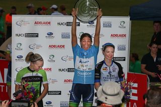 Katrin Garfoot (Orica-AIS) raises the trophy of the overall winner at the Santos Women's Tour