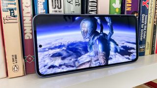 Blue Beetle flies above earth on the Samsung Galaxy A54