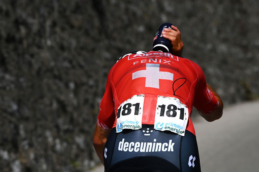 NOVAZZANO SWITZERLAND JUNE 16 Silvan Dillier of Switzerland and Team AlpecinFenix refreshes himself competing in the breakaway during the 85th Tour de Suisse 2022 Stage 5 a 1901km stage from Ambri to Novazzano 364m ourdesuisse2022 WorldTour on June 16 2022 in Novazzano Switzerland Photo by Tim de WaeleGetty Images