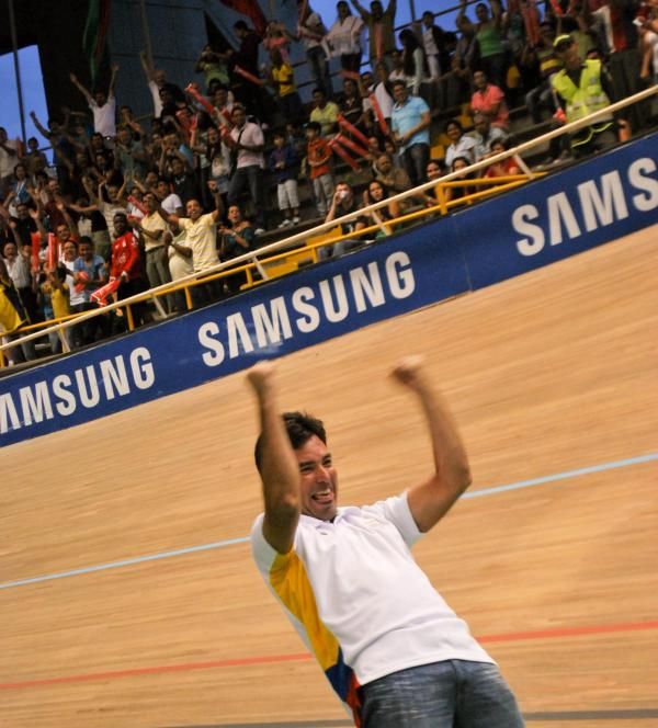 Julian Velasquez, Colombia's coach, celebrates his men's win in the Madison