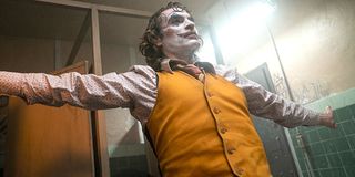 Joaquin Phoenix spreads arms in Joker makeup