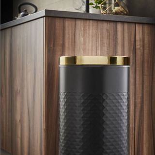 black coloured round pedal bin with soft closing lid