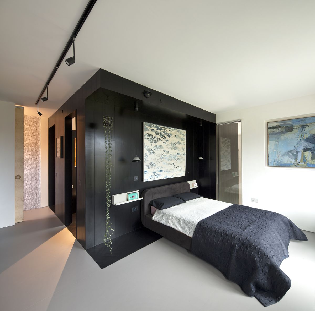bedroom with black timber panelling