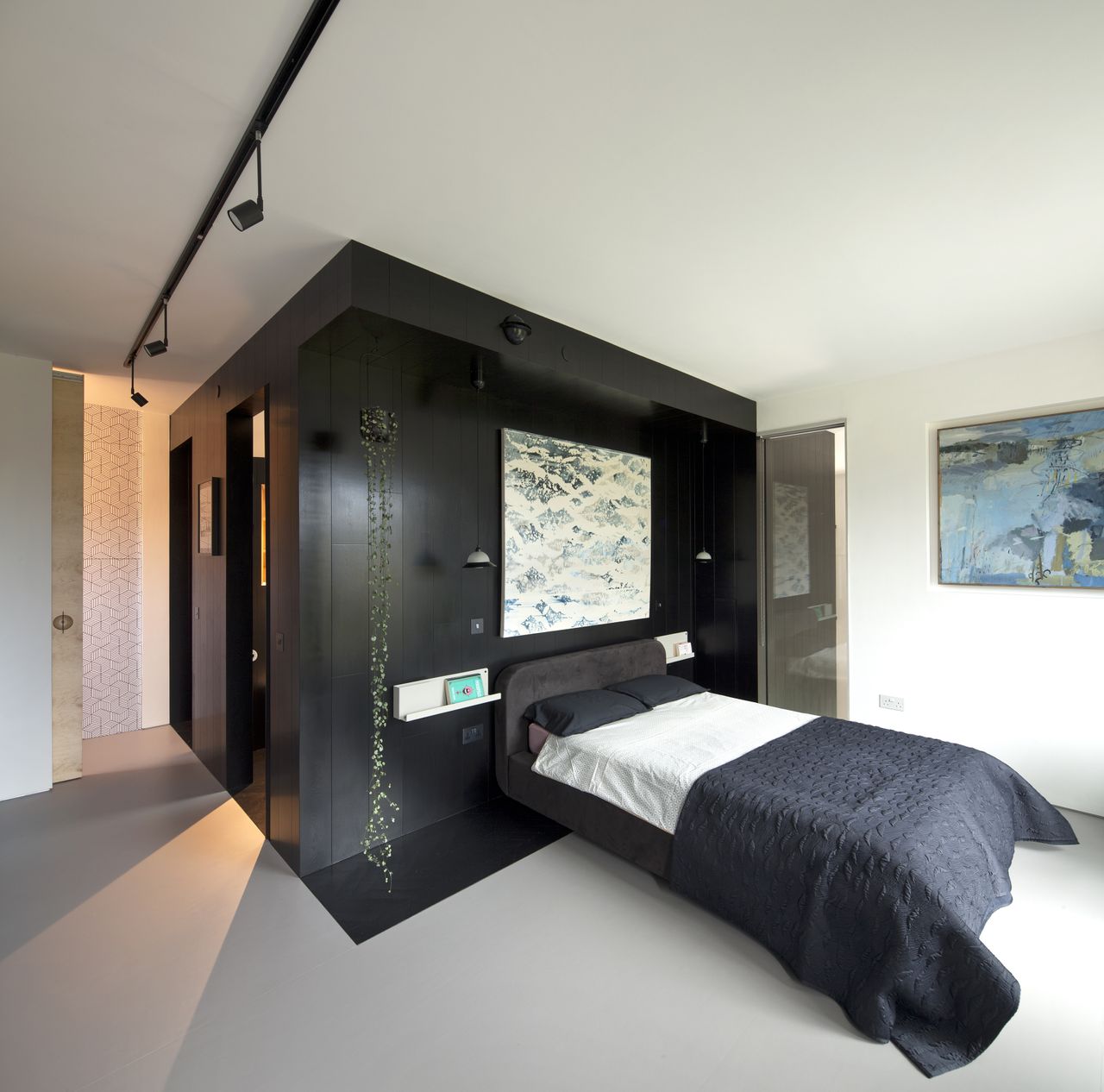 bedroom with black timber panelling