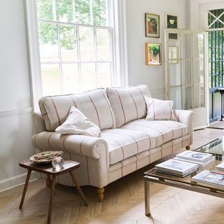 Sofas & Stuff's Aldingbourne 3 Seater Sofa in Grain Stripe in front of the living room window with a glass coffee table in front of it