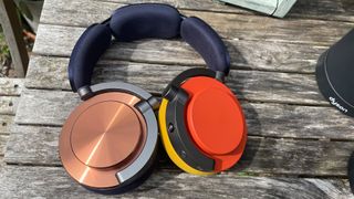 Dyson OnTrac wireless headphones on table with different coloured ear caps