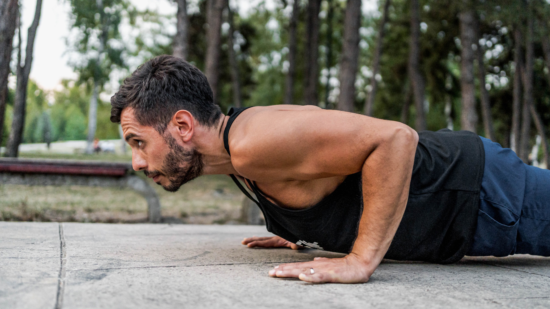 A man performing a hand release push up