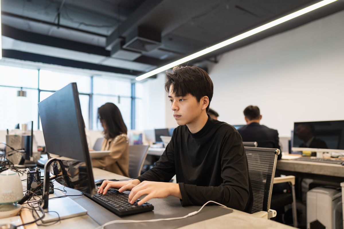 A worker at a PC at an office in China